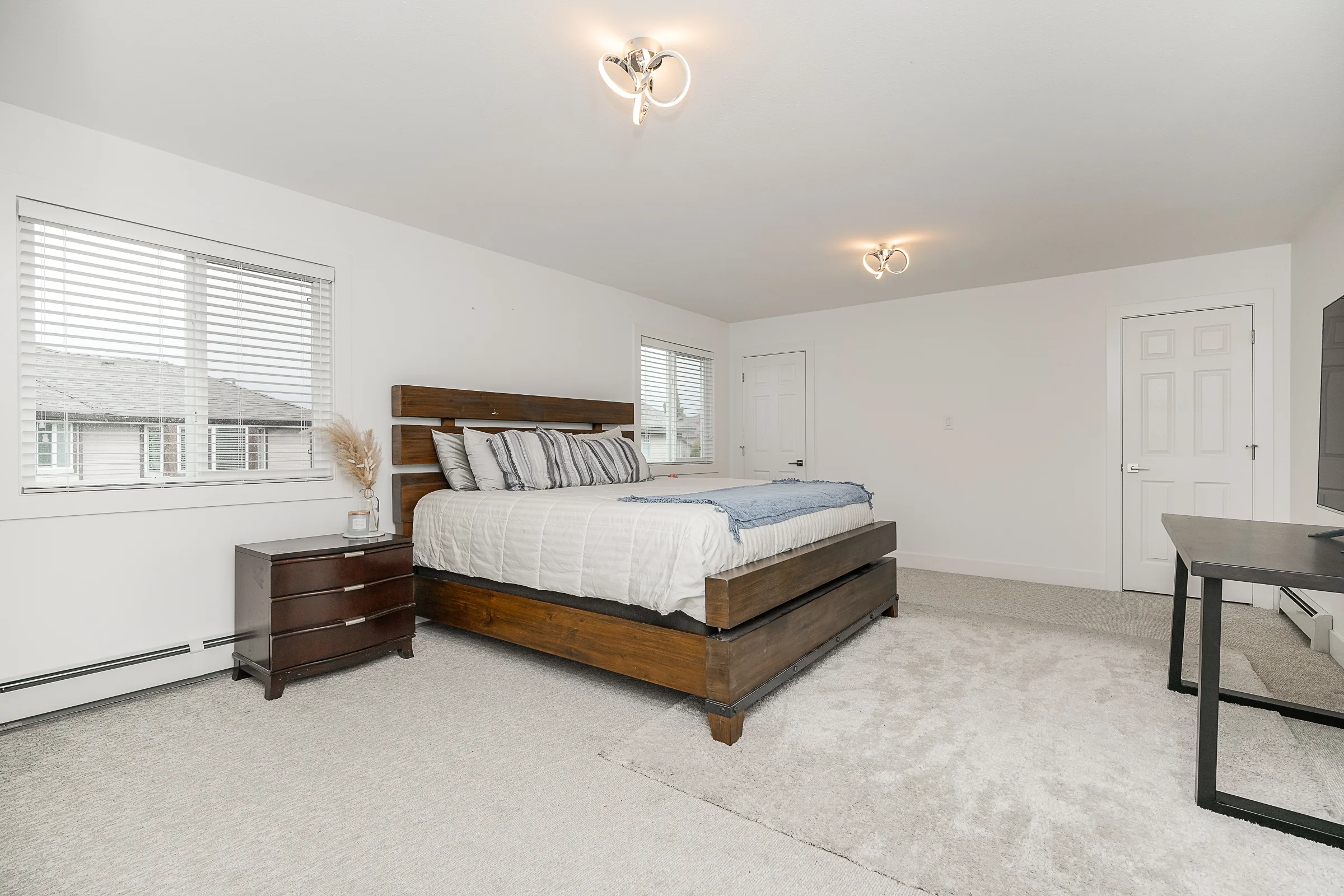 Primary bedroom · wood platform bed