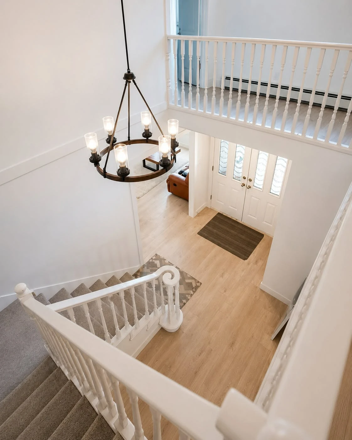 Two-storey foyer · iron chandelier