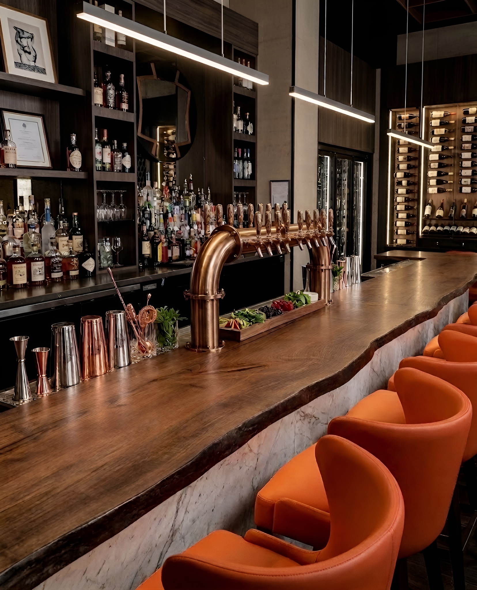 Cocktail bar with copper tap tower, custom millwork, and live-edge counter