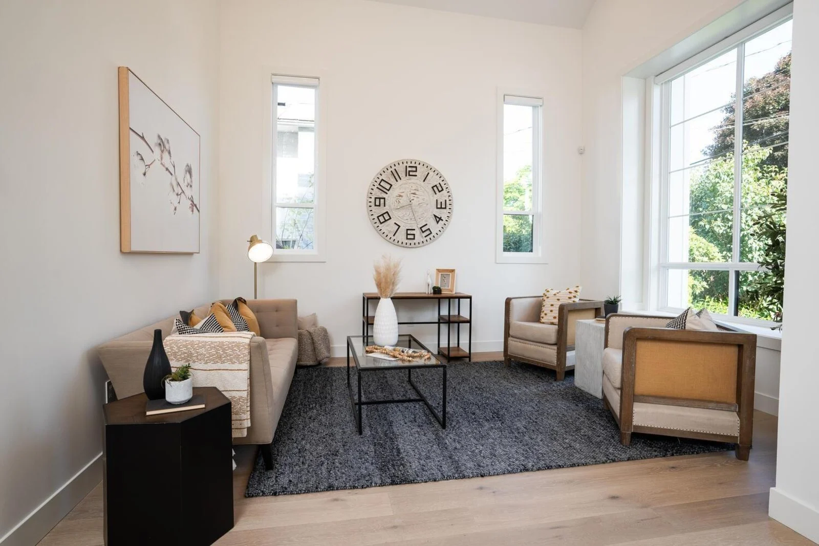 Bright compact suite living area with cathedral ceiling and natural light