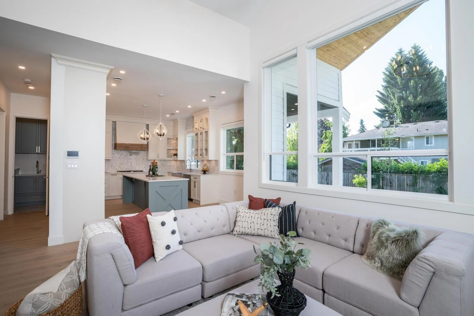 Open-concept living room flowing into kitchen after structural wall removal